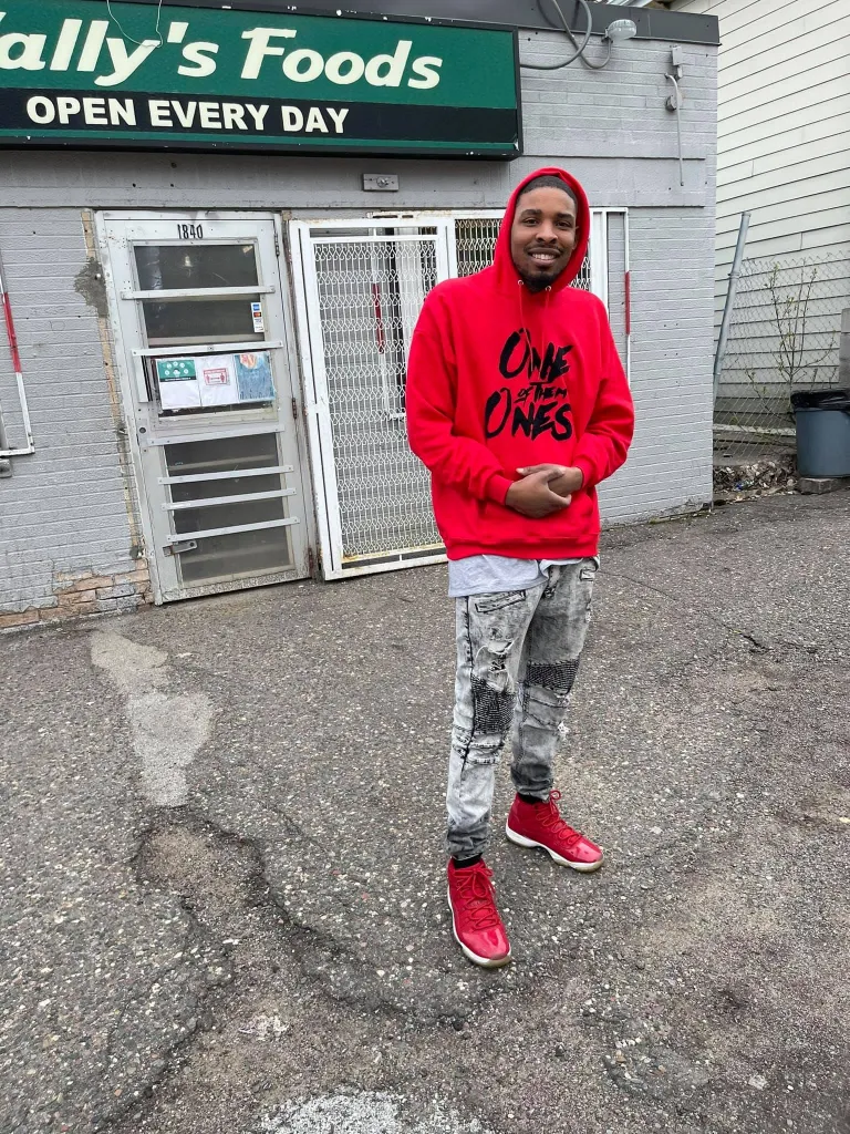 Carlton Johnson, the Minneapolis shooting suspect, stands in front of 