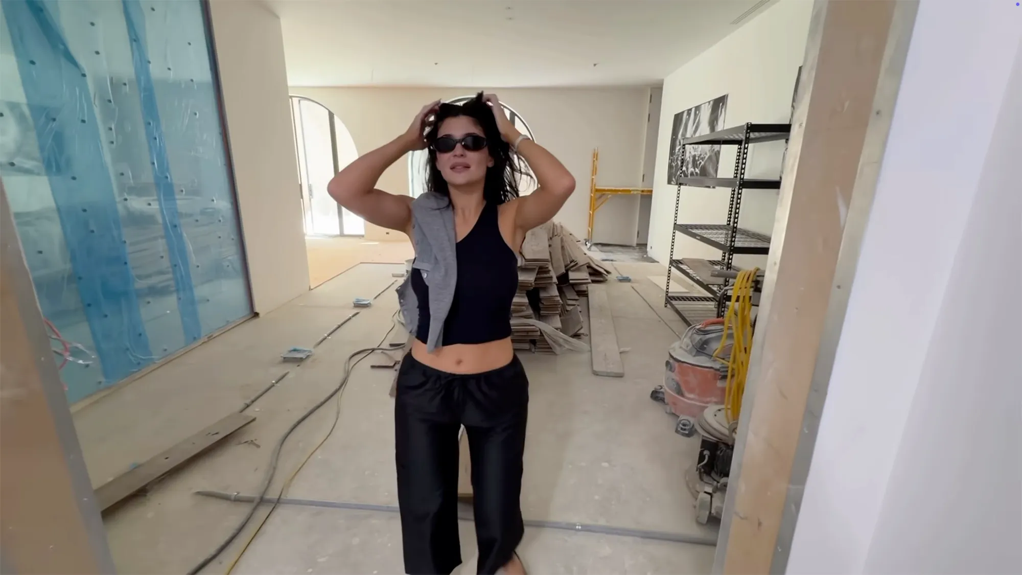 Kylie Jenner standing in her new home under construction.