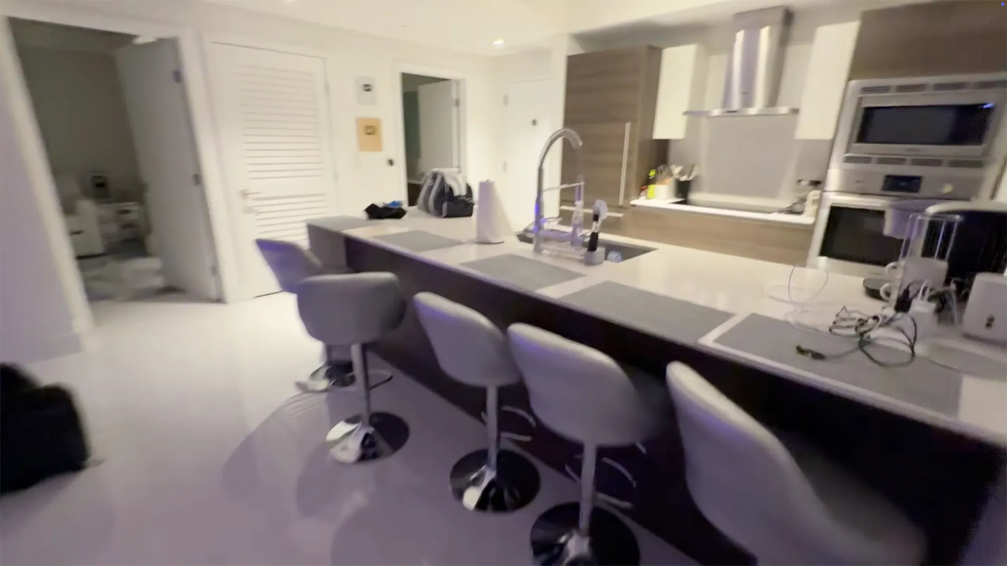 Kai Trump's college apartment kitchen with a breakfast bar.