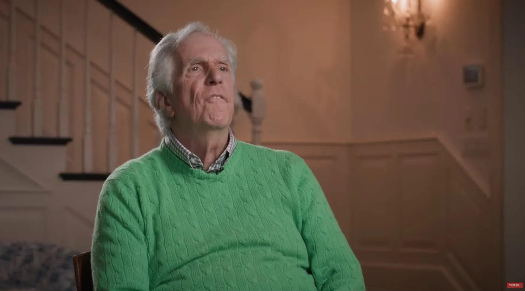 Henry Winkler in a green sweater.