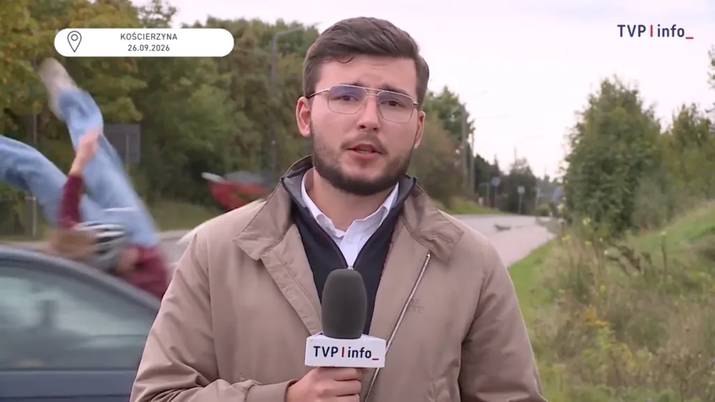 A TVP Info reporter speaking into a microphone while, in the background, a teenage girl is struck by a car.