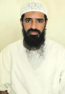 Walid Muhammad Salih Mubarak Bin 'Attash wearing a white kufi and white thobe, with a dark beard.