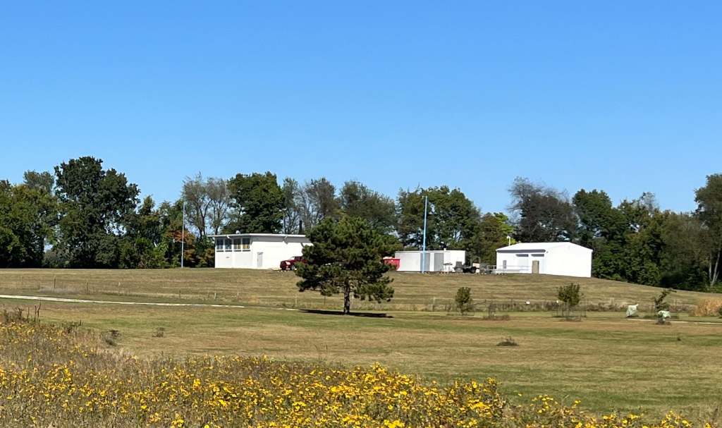 A bunker complex constructed on a large grassy field.