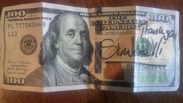 Yawson got a 100 on all parts of the exam, giving Simonelli the honor of delivering the prize, a signed $100 to his student.