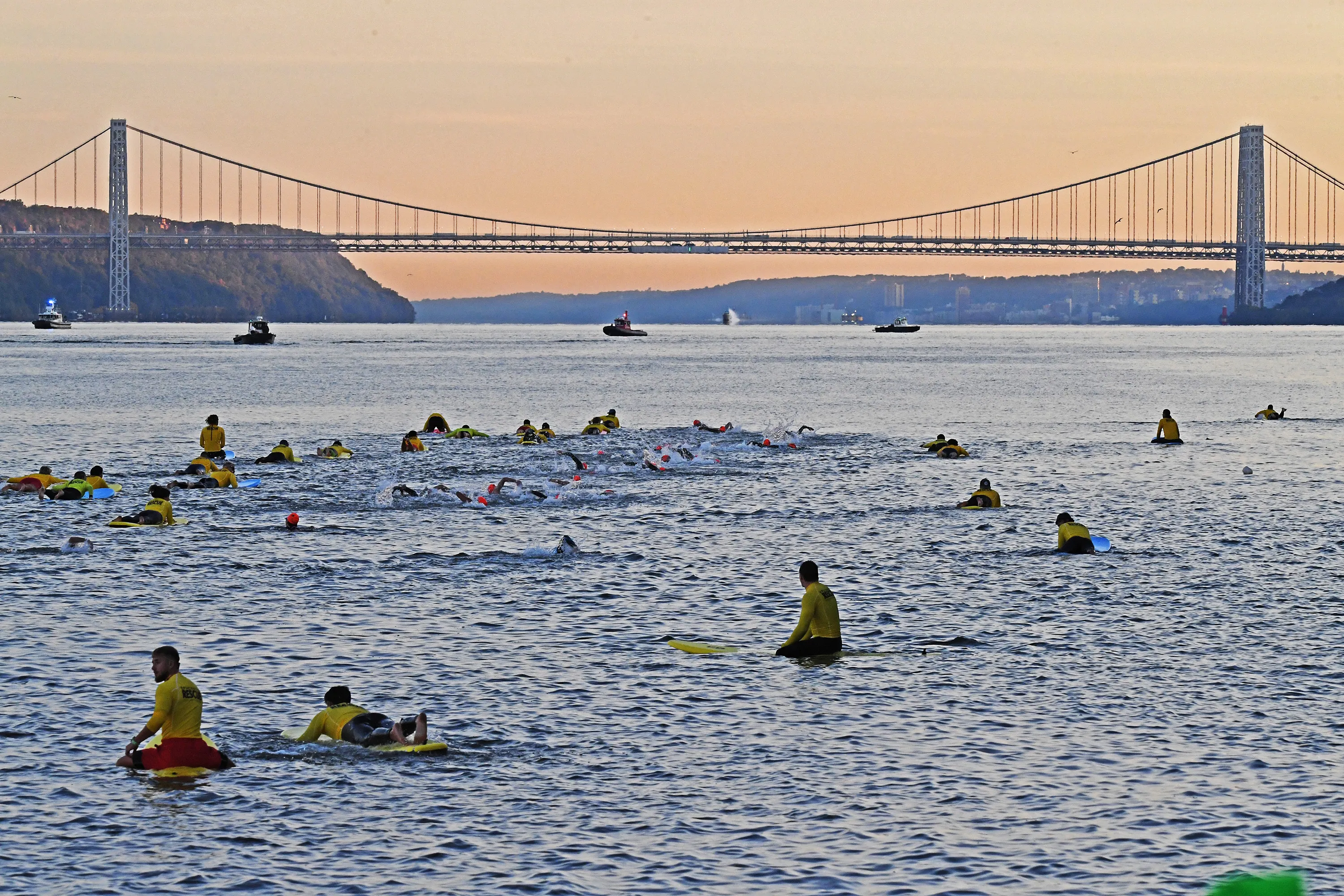 Competitors enter the Hudson River at the start of the NYC Triathlon.