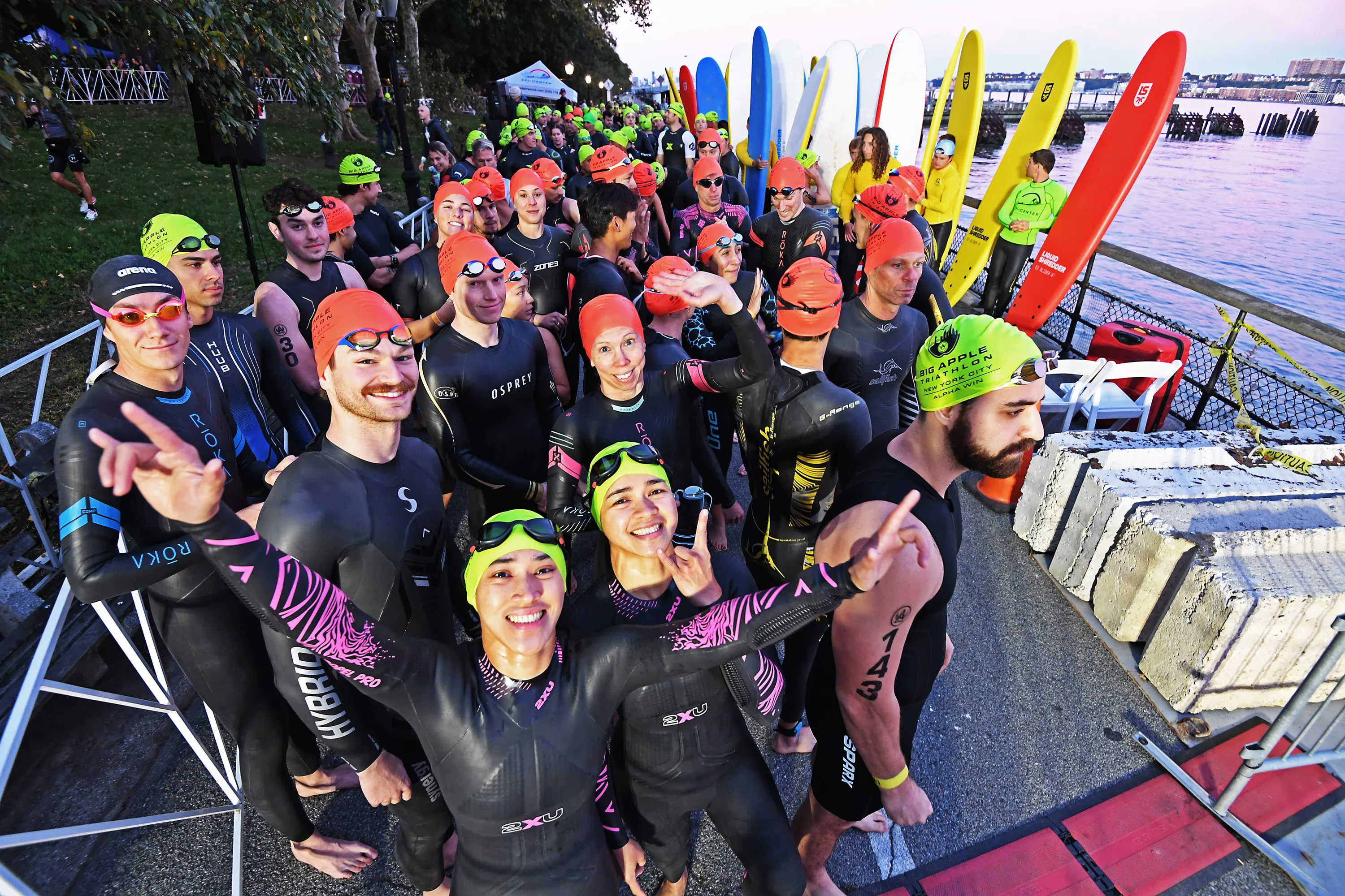 Competitors gather at the starting line of the NYC Triathlon for a swim up the Hudson River.