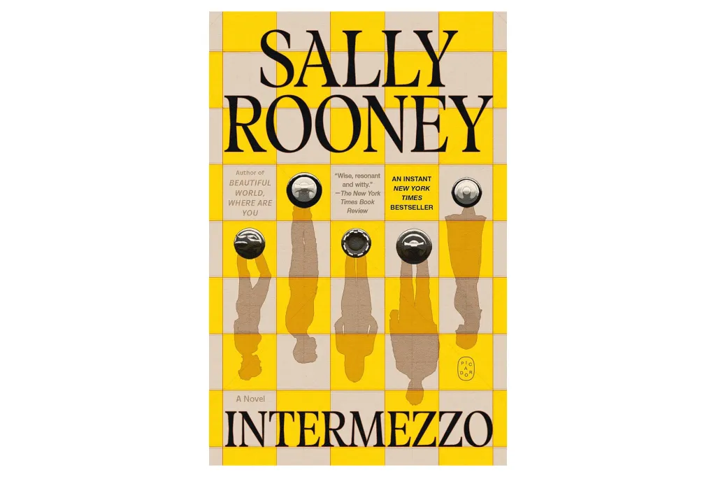 Book cover of Intermezzo by Sally Rooney, featuring a yellow and white checkered background with five chess pieces casting shadows of people.