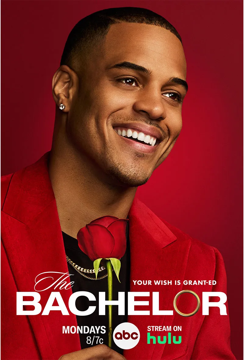 Portrait of Grant Ellis holding a red rose for The Bachelor.