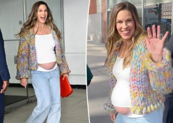 Hilary Swank, 52, debuts bare baby bump after announcing third pregnancy