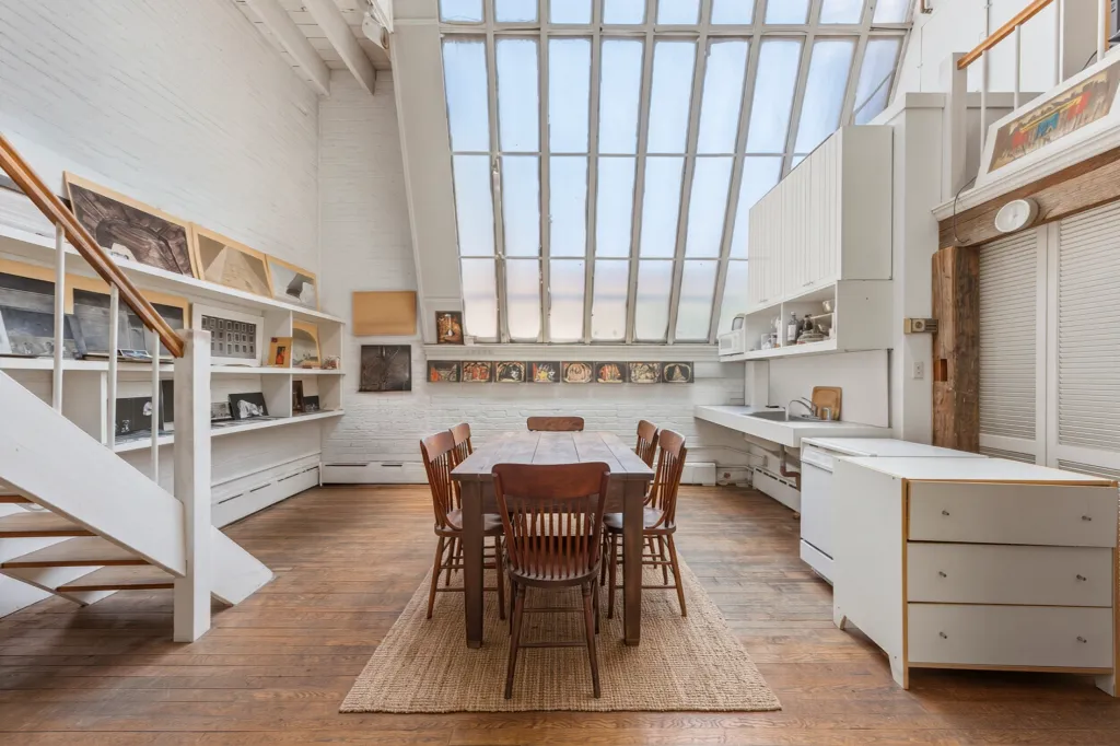 The wall of windows allows the space to fill with sunlight.