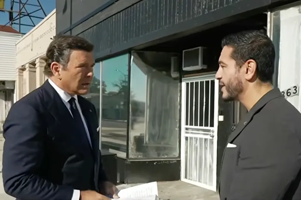 Two men in suits standing outside a building.