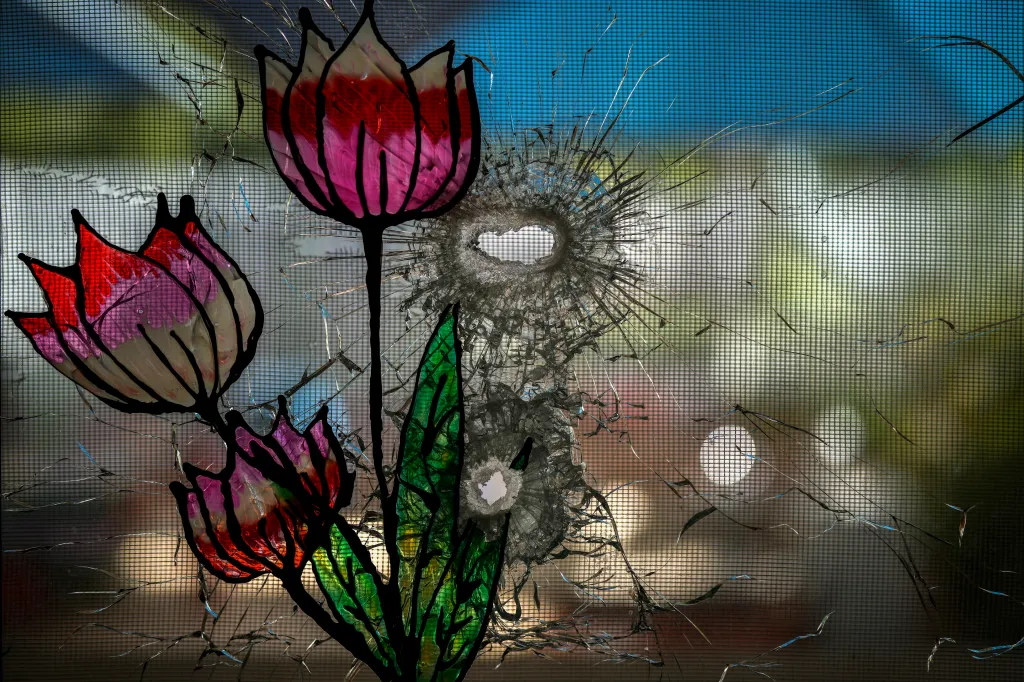 Bullet holes through a decorated window of a kindergarten and nursery school destroyed during the attack by Hamas at Kibbutz Be'eri, Israel.