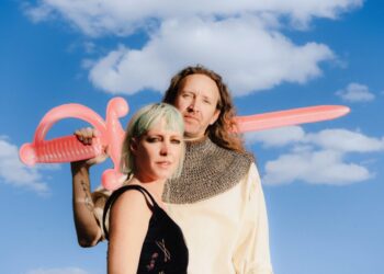 A married synth-pop duo used to go it alone. Now, they’re bringing friends to the fold.
