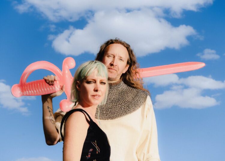 A married synth-pop duo used to go it alone. Now, they’re bringing friends to the fold.