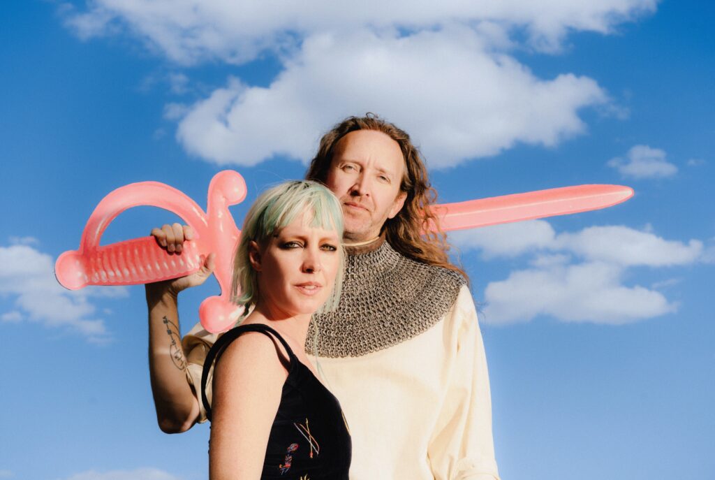 A married synth-pop duo used to go it alone. Now, they’re bringing friends to the fold.