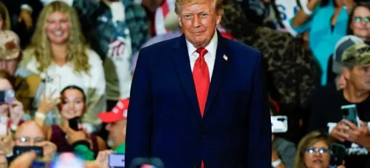 MAGA fan rushes back to Trump rally in hospital gown after having a seizure