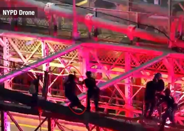 Drone footage captures moment police fatally shoot knife-wielding nut — as he lunges at them from atop the Brooklyn Bridge