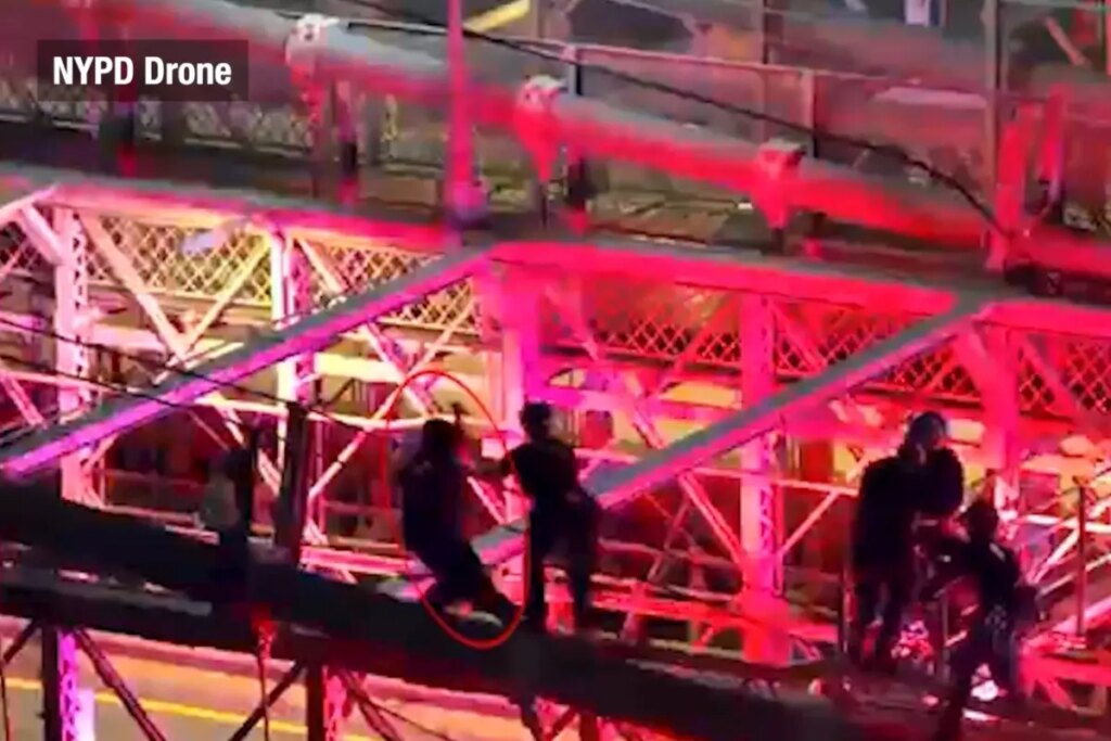 Drone footage captures moment police fatally shoot knife-wielding nut — as he lunges at them from atop the Brooklyn Bridge