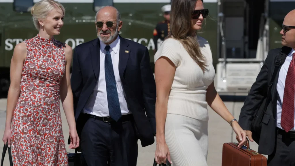 Trump gushes over ‘beautiful’ younger aide onstage as Natalie Harp looks on