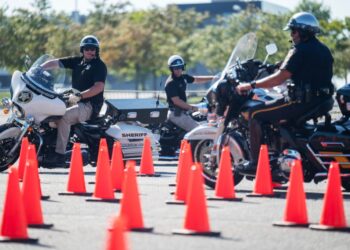 On Harleys and BMWs, officers rumble through a police motorcycle rodeo