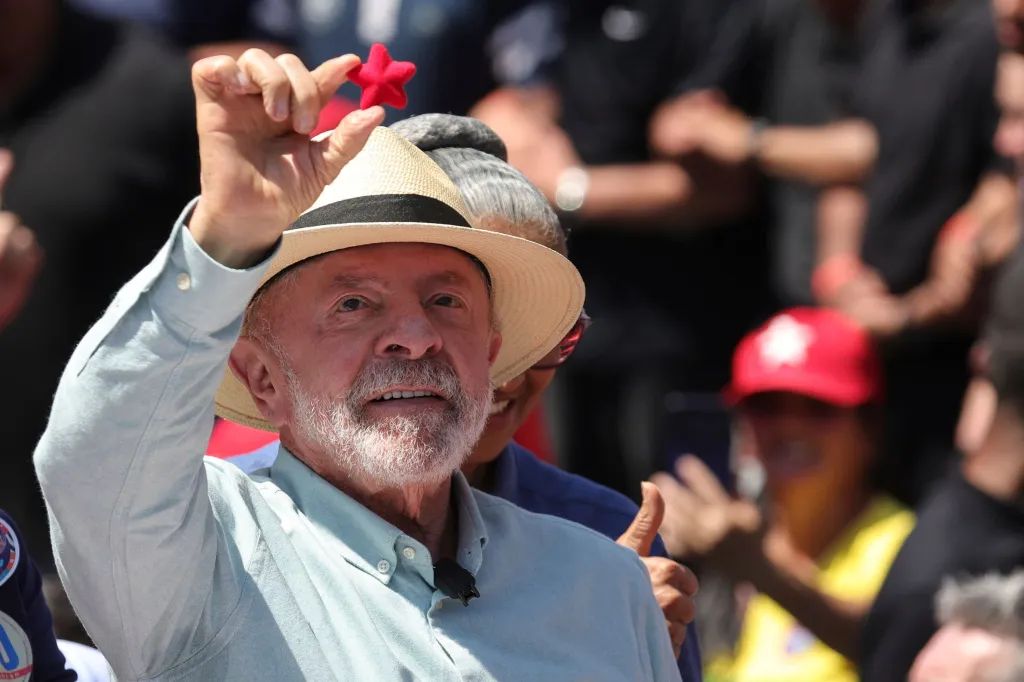 Brazilian President Luiz Inacio Lula da Silva holds up a small red star during a campaign rally in Sao Paulo.