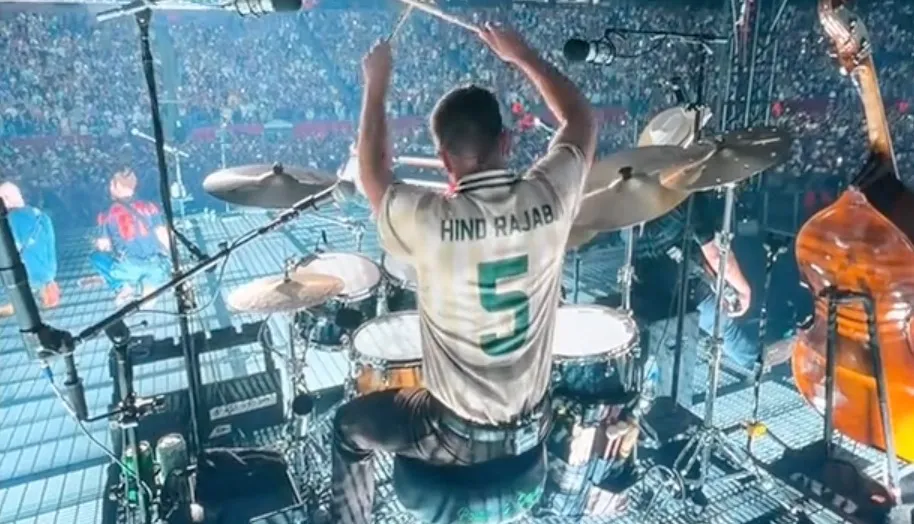 Zach Bryan's drummer wearing a jersey that reads 