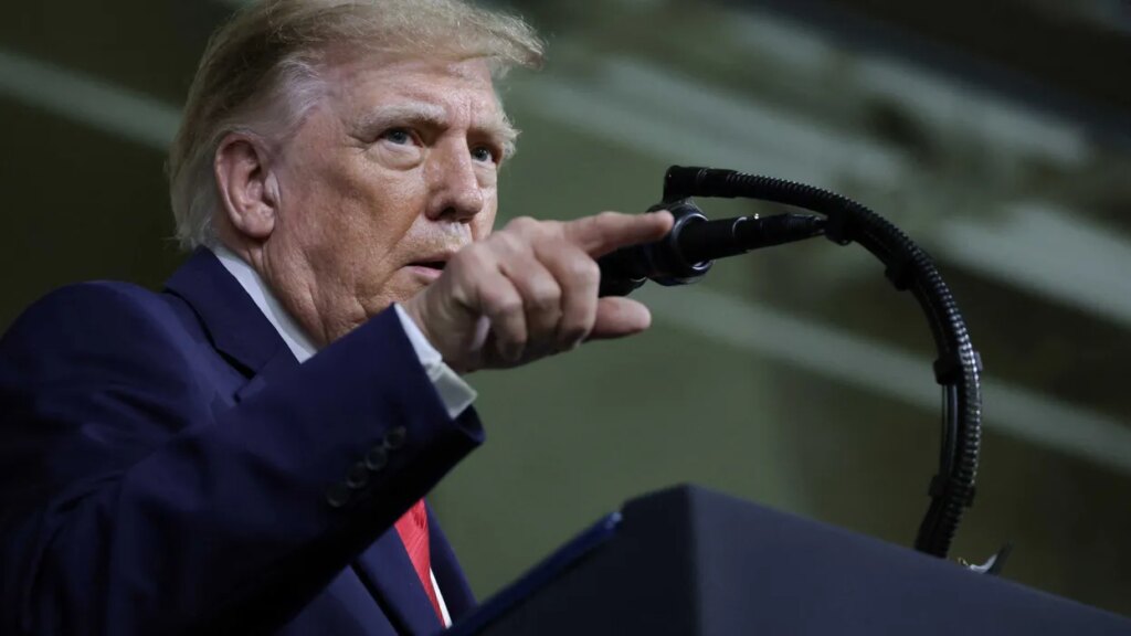 Trump singles out lone protester with baseless accusation: ‘How much is she being paid?’