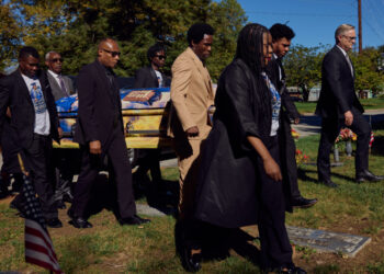 As Trump rallies his base in Ohio, a Haitian migrant is laid to rest nearby
