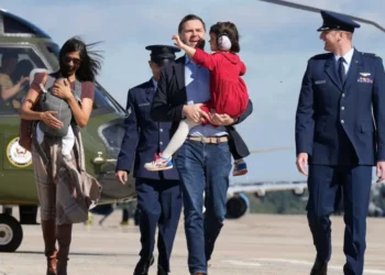 Usha Vance nearly tumbles down helicopter stairs while carrying infant son