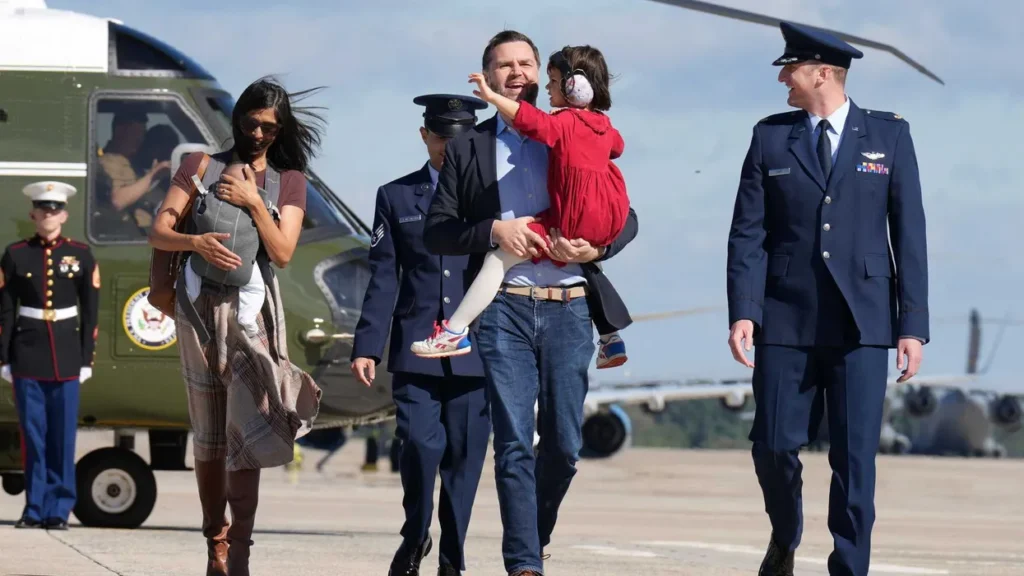 Usha Vance nearly tumbles down helicopter stairs while carrying infant son