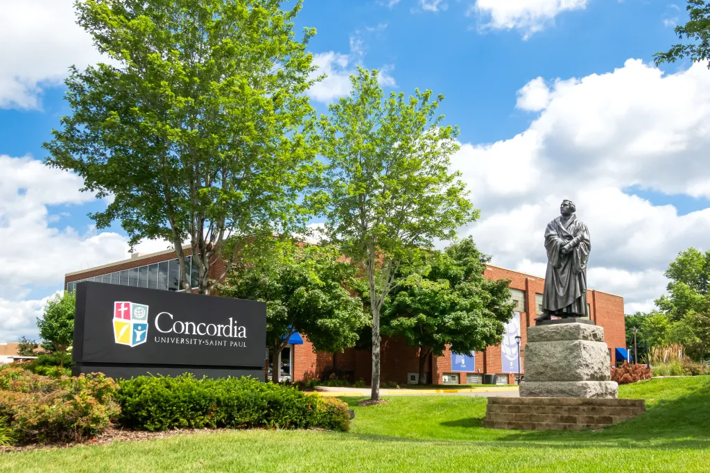 Entrance sign and Martin Luther statue on the campus of Concordia University St. Paul.