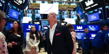 Stocks hit record high even as consumers feel dreary