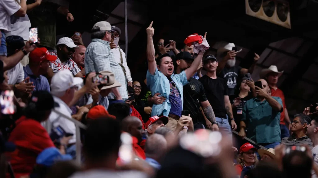MAGA fan assaults Trump protester on his way out the door at Texas rally