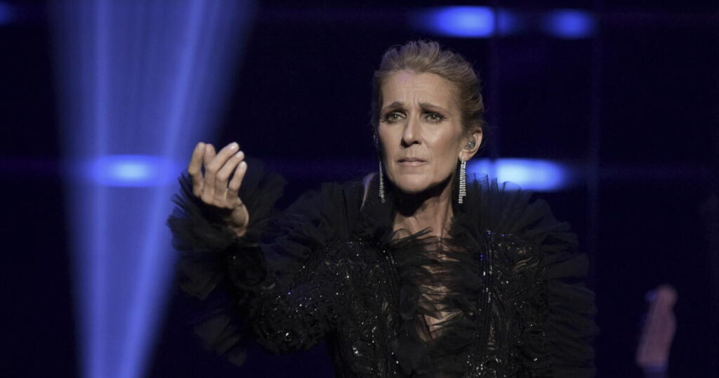 Céline Dion takes a tumble, but goes on