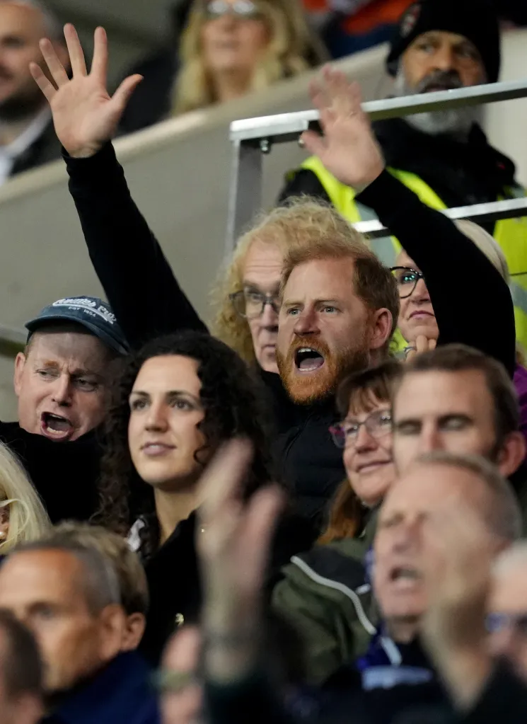 The Duke of Sussex cheering in the stands at a rugby match.