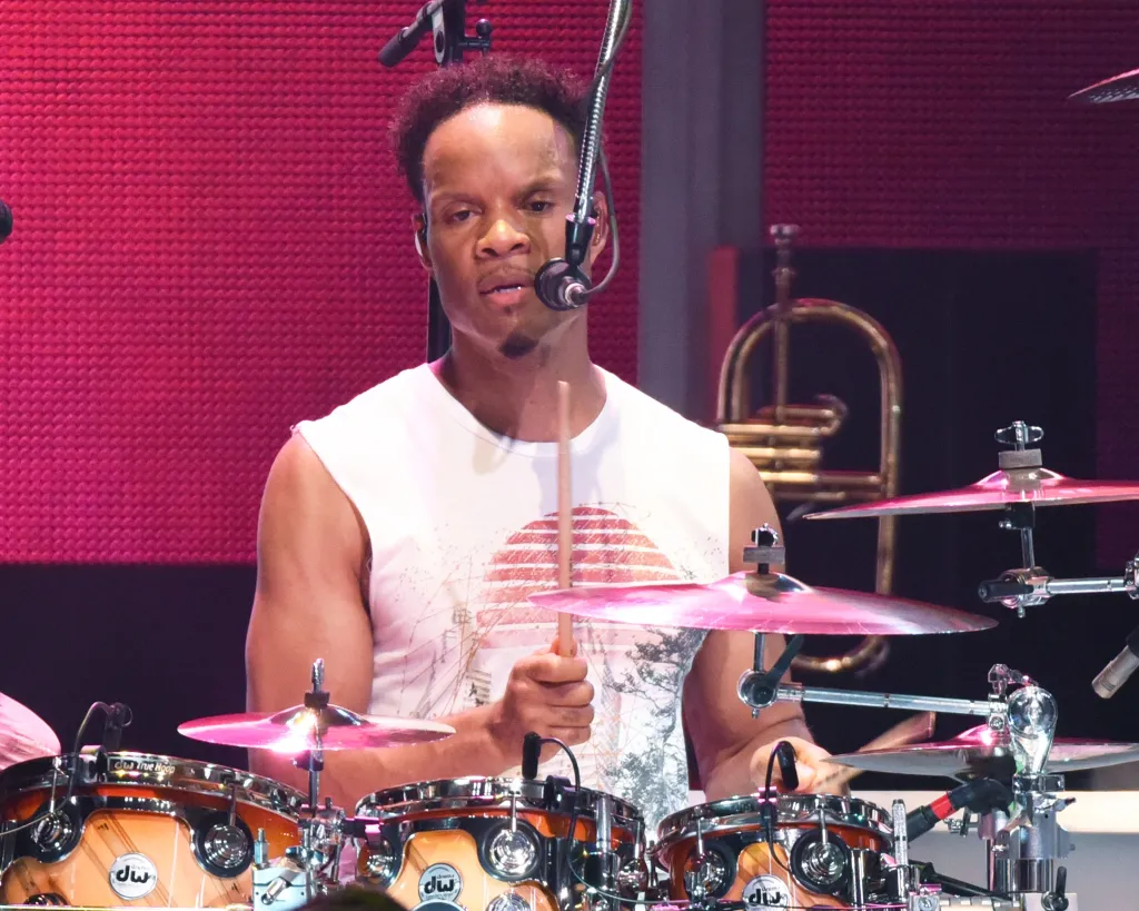 John Paris of Earth, Wind and Fire performs on drums on stage.