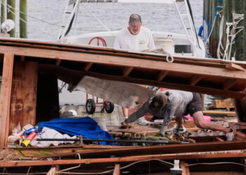 Isaias weakens, but flooding threat and outages persist