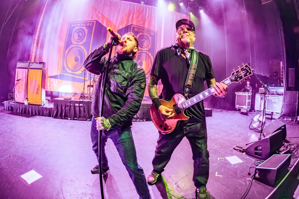Frank Carter and Steve Jones of the Sex Pistols perform live on stage.