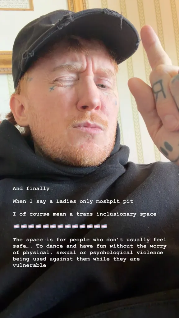 Frank Carter in a black hoodie and cap pointing a finger upward, with text overlaying his image explaining that the women-only mosh pit is a trans-inclusionary and safe space.