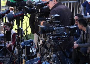 DOJ is investigating news organizations for antitrust violations after the White House TV pool halted coverage when Trump banned several outlets