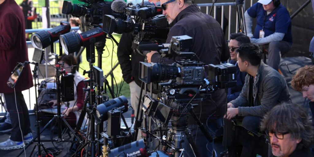 DOJ is investigating news organizations for antitrust violations after the White House TV pool halted coverage when Trump banned several outlets