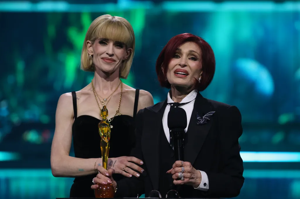 Kelly Osbourne and Sharon Osbourne on stage accepting the 'Lifetime Achievement' award on behalf of the late Ozzy Osbourne at The BRIT Awards.