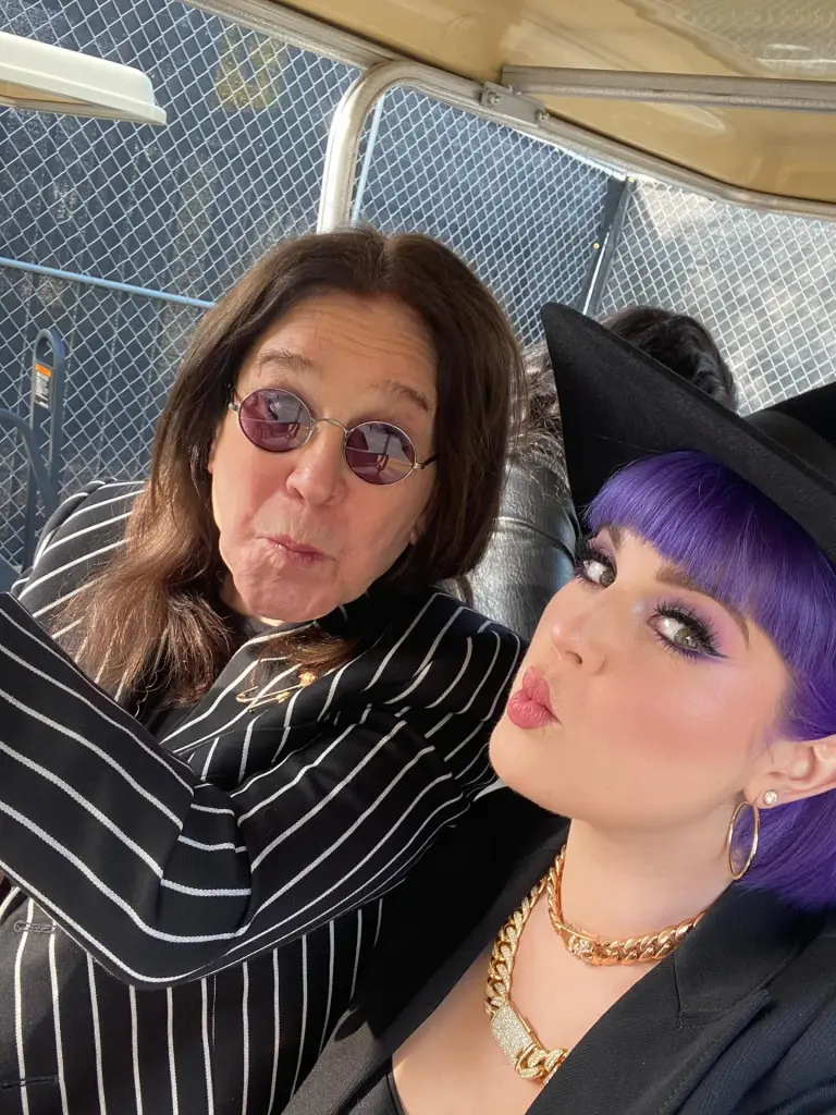 Kelly and Ozzy Osbourne taking a selfie together.