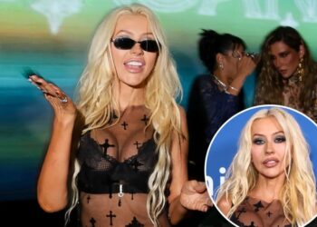 Iconic pop star, 45, stuns in sheer leather ensemble
