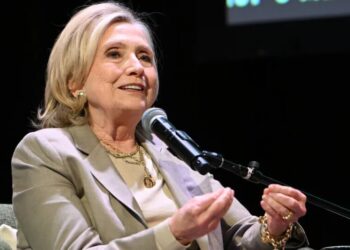 Hillary Clinton Steps to the Podcast Mic as Midterms Approach
