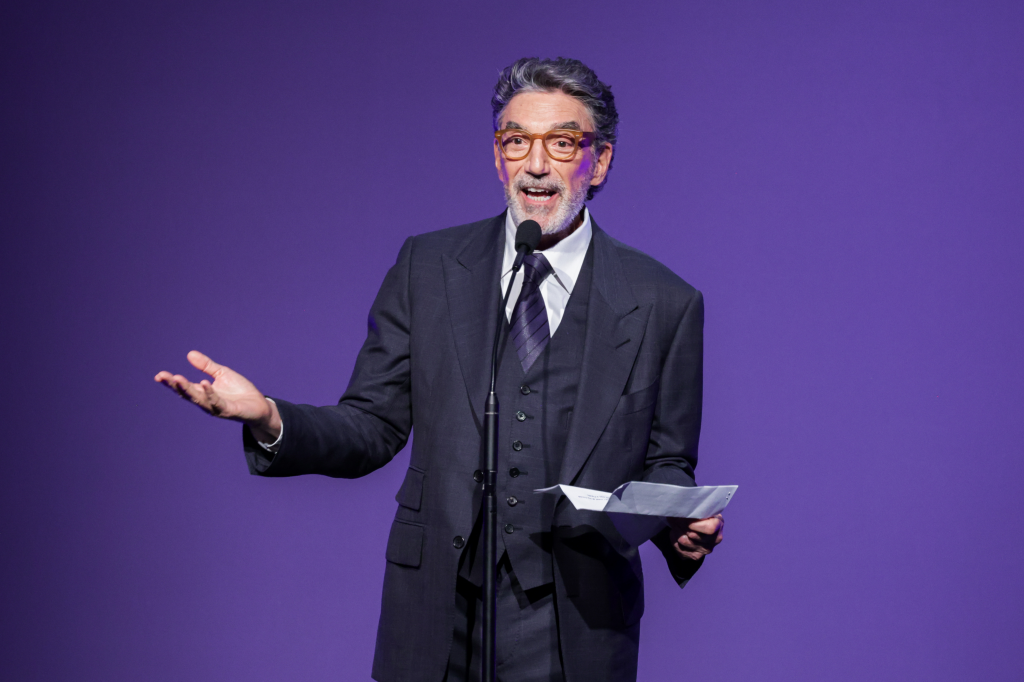 Chuck Lorre speaking on stage at the 51st Annual Gracie Awards.