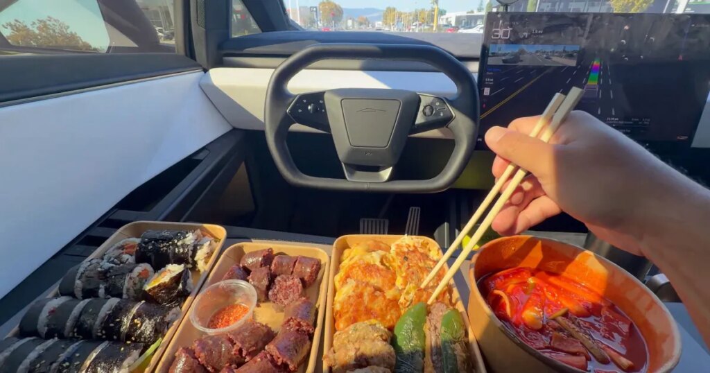 Tesla Bros Posting Videos Showing Them Hog Out on Decadent Meals While Careening Down the Road in Self-Driving Mode