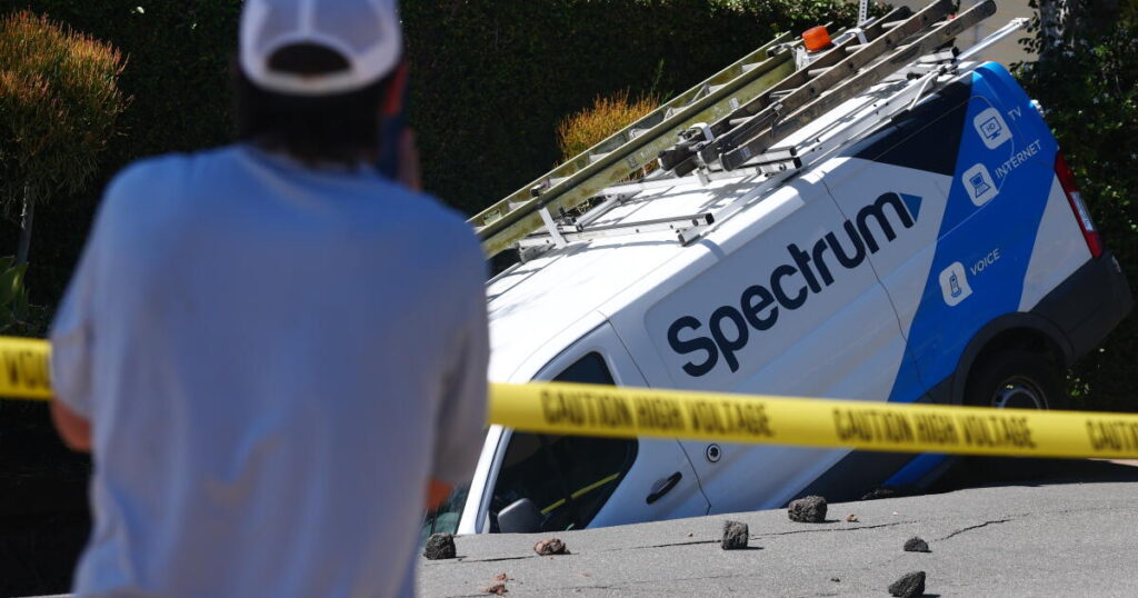 Broken water main spawns sinkhole in Los Feliz, traps Spectrum van