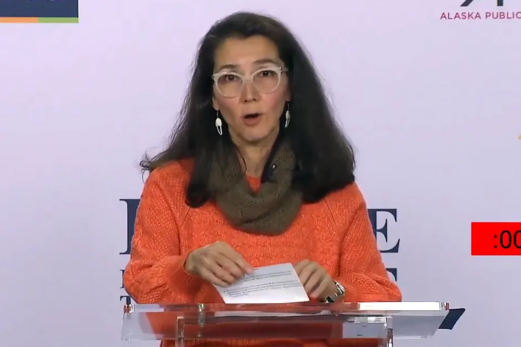 Alaska Democratic Senate candidate Mary Peltola looks down at notecards while responding to questions during a debate.