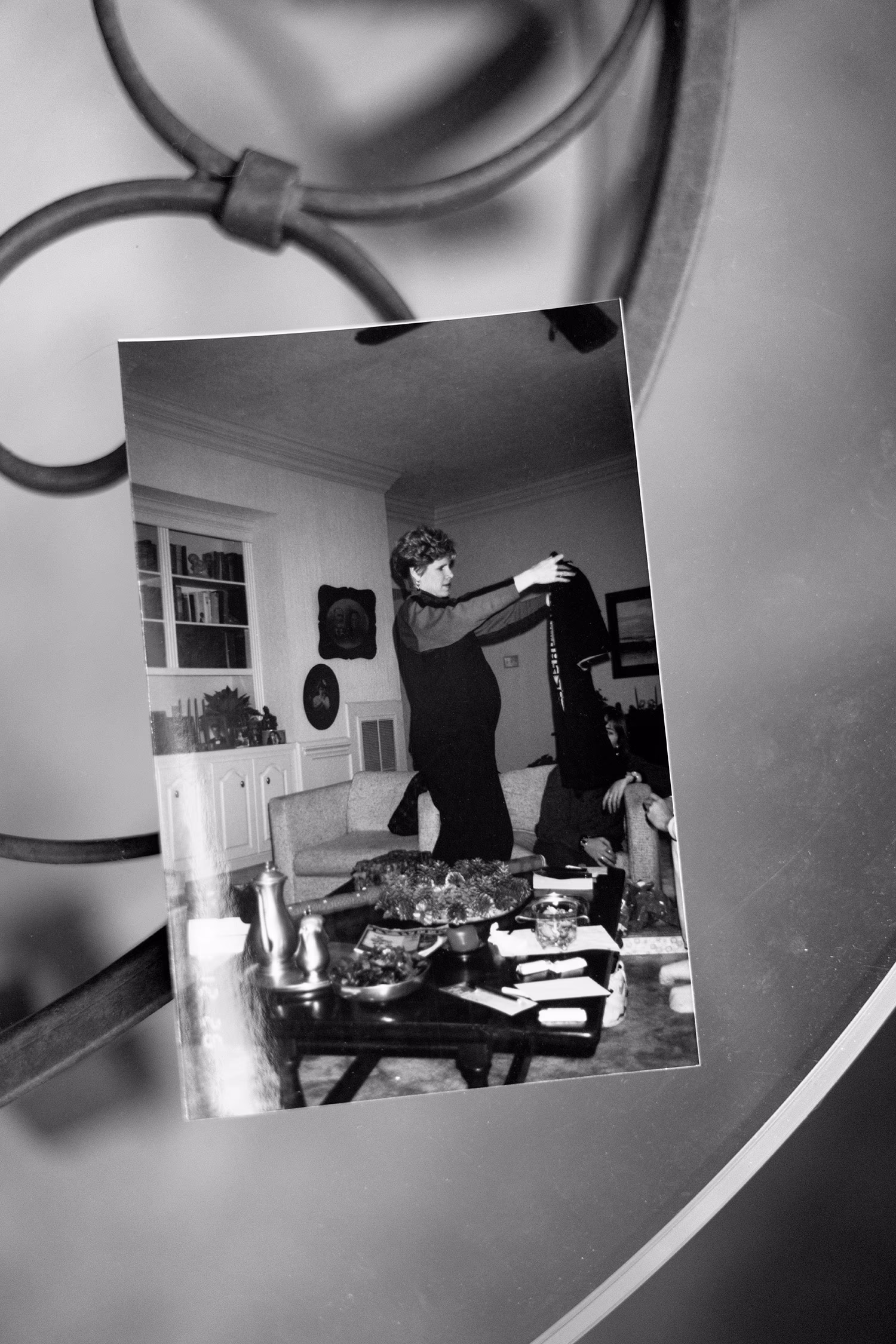  A photograph of Cyndy opening Christmas presents while pregnant with his first son.